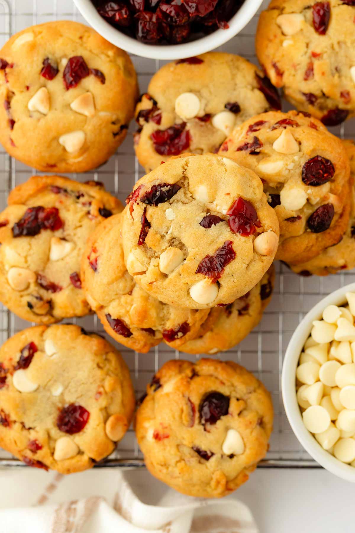 overhead view of cranberry white chocolate chip cookies on wire rack