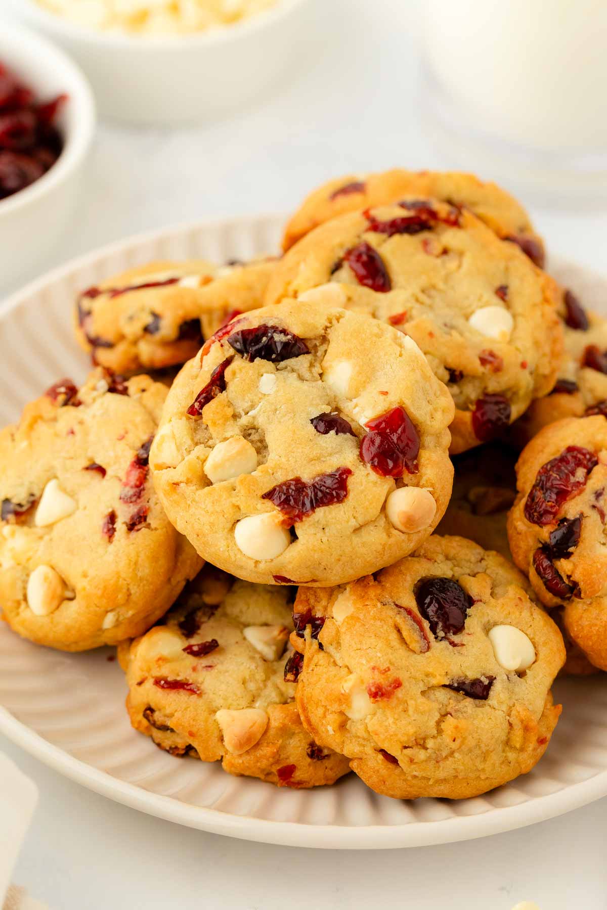 frontal view of cranberry white chocolate chip cookies on white plate