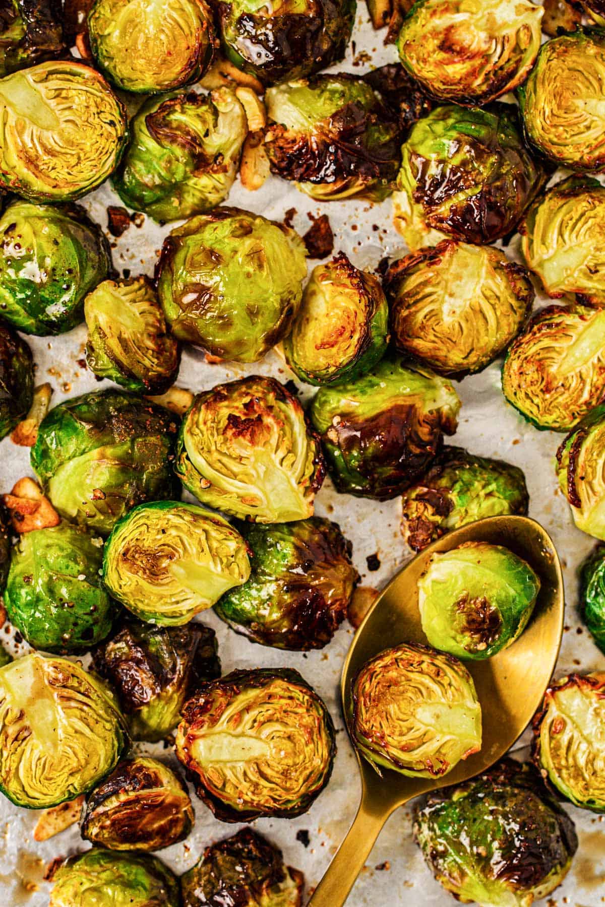 overhead view of roasted brussels sprouts drizzled with balsamic vinegar