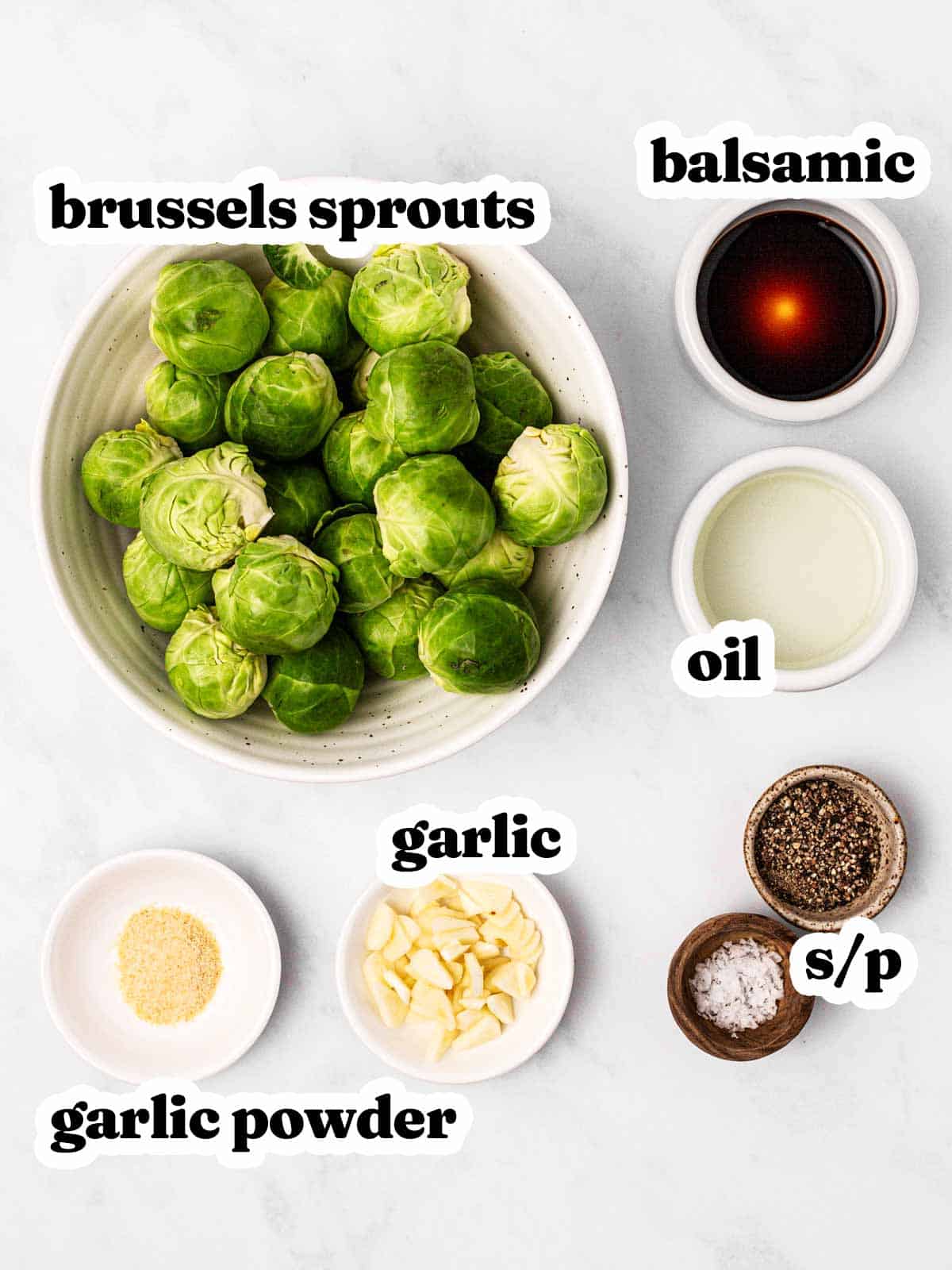 overhead view of ingredients to make garlic roasted Brussels sprouts with text labels