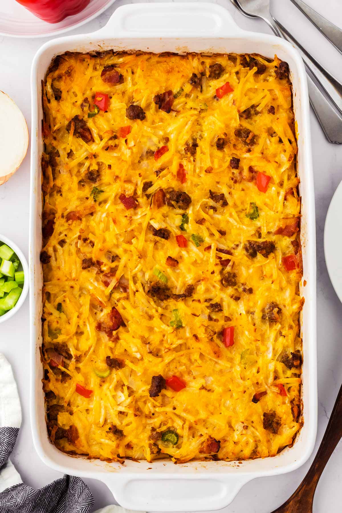 overhead view of hash brown breakfast casserole in white casserole dish