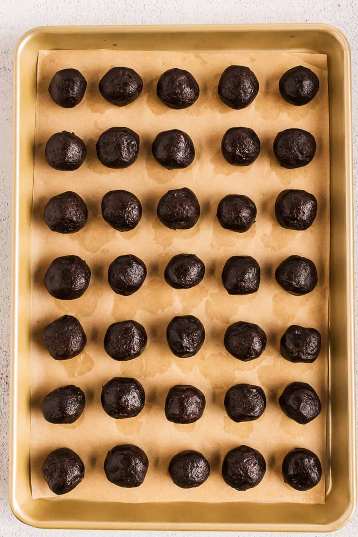 rolled oreo truffles on baking sheet