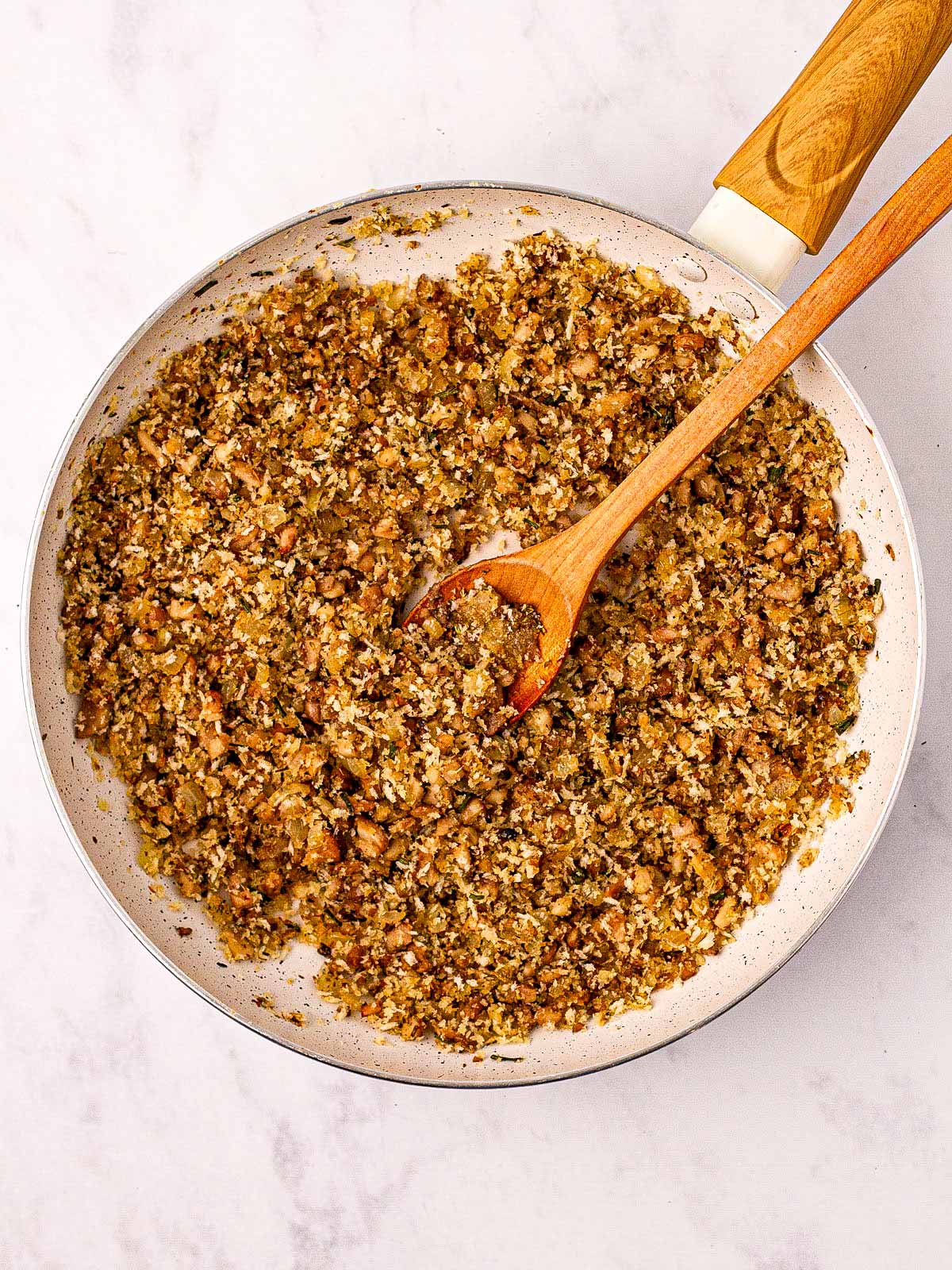 overhead view of stuffed mushroom filling in skillet