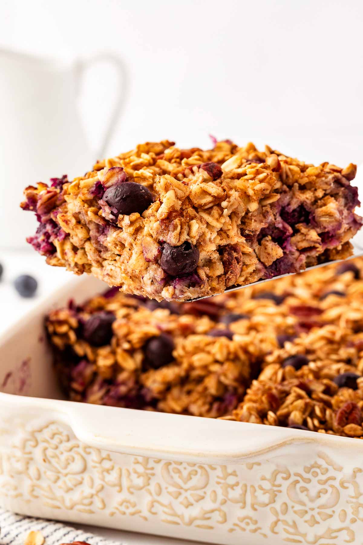 frontal view of sliced blueberry baked oatmeal on spatula