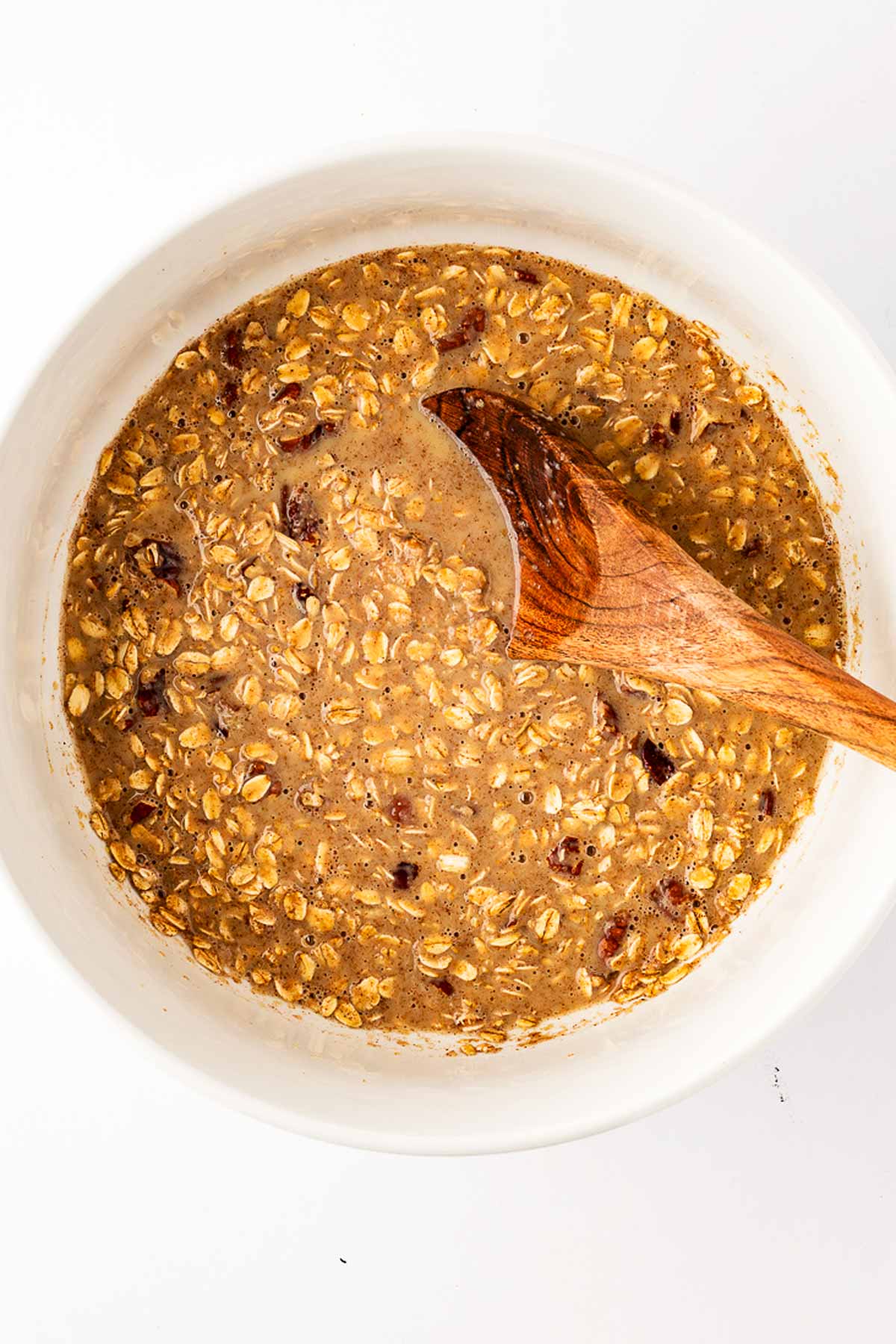 overhead view of oatmeal mixture in white bowl