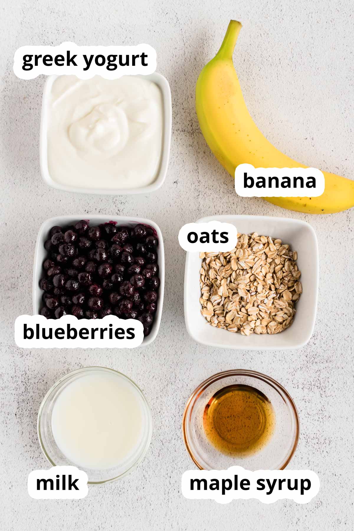 overhead view of ingredients to make Blueberry Banana Smoothie with text labels