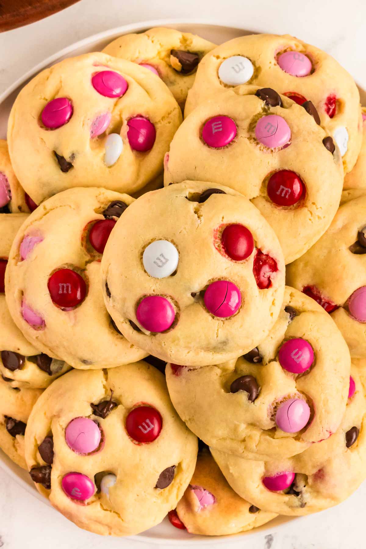 overhead view of Valentine's Day cookies on white plate