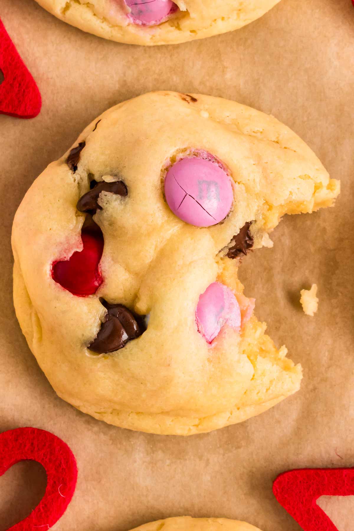 overhead view of Valentine's Day cookie with a bite taken out