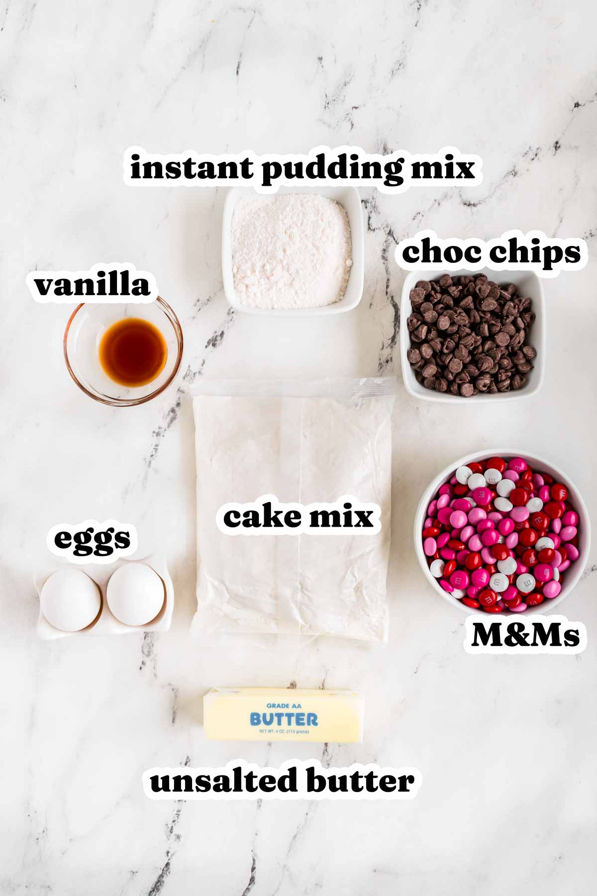 
overhead view of ingredients to make valentine’s day cake mix cookies with text labels