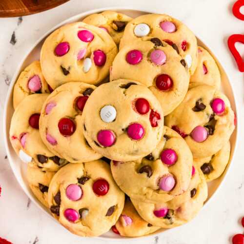 overhead view of Valentine's Day cookies on white plate