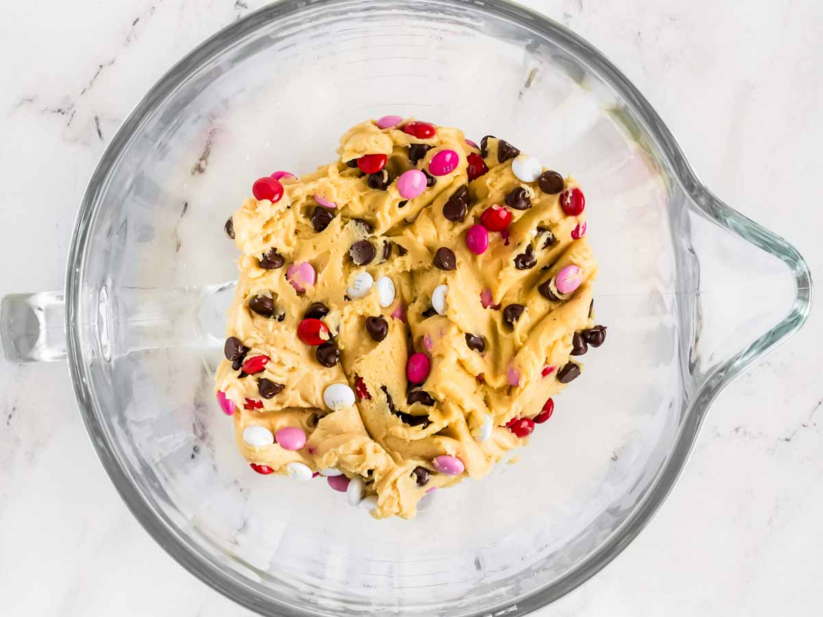 overhead view of valentines day cookie dough in glass bowl