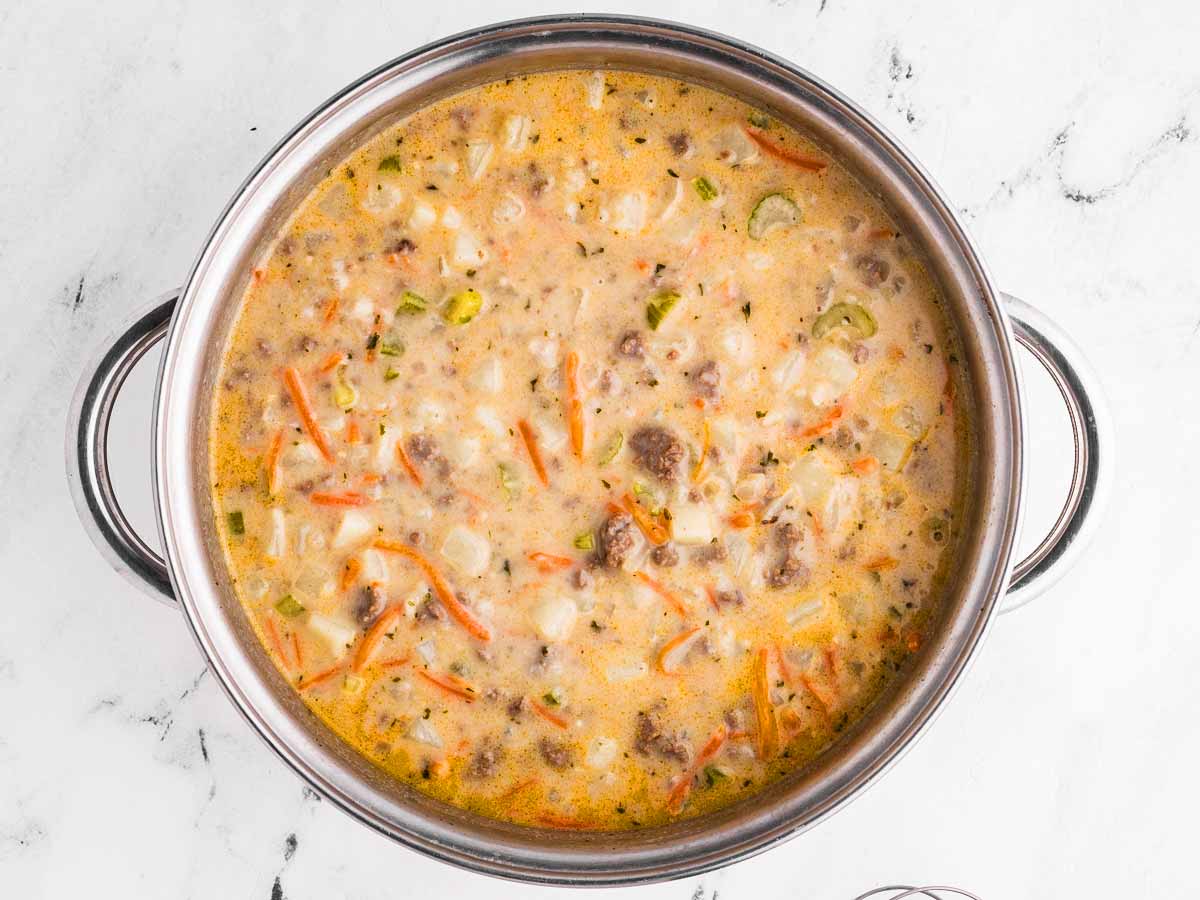 overhead view of creamy soup in pot