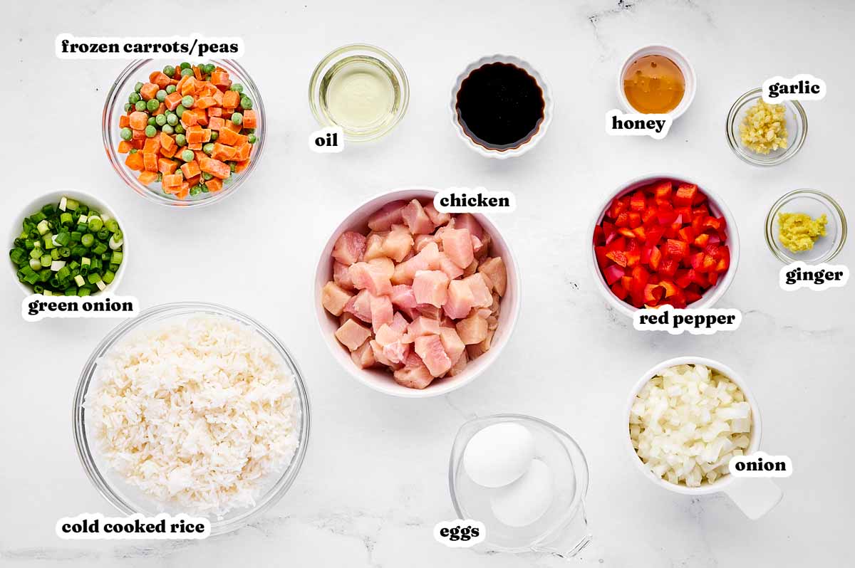 overhead view of ingredients for chicken fried rice with text labels