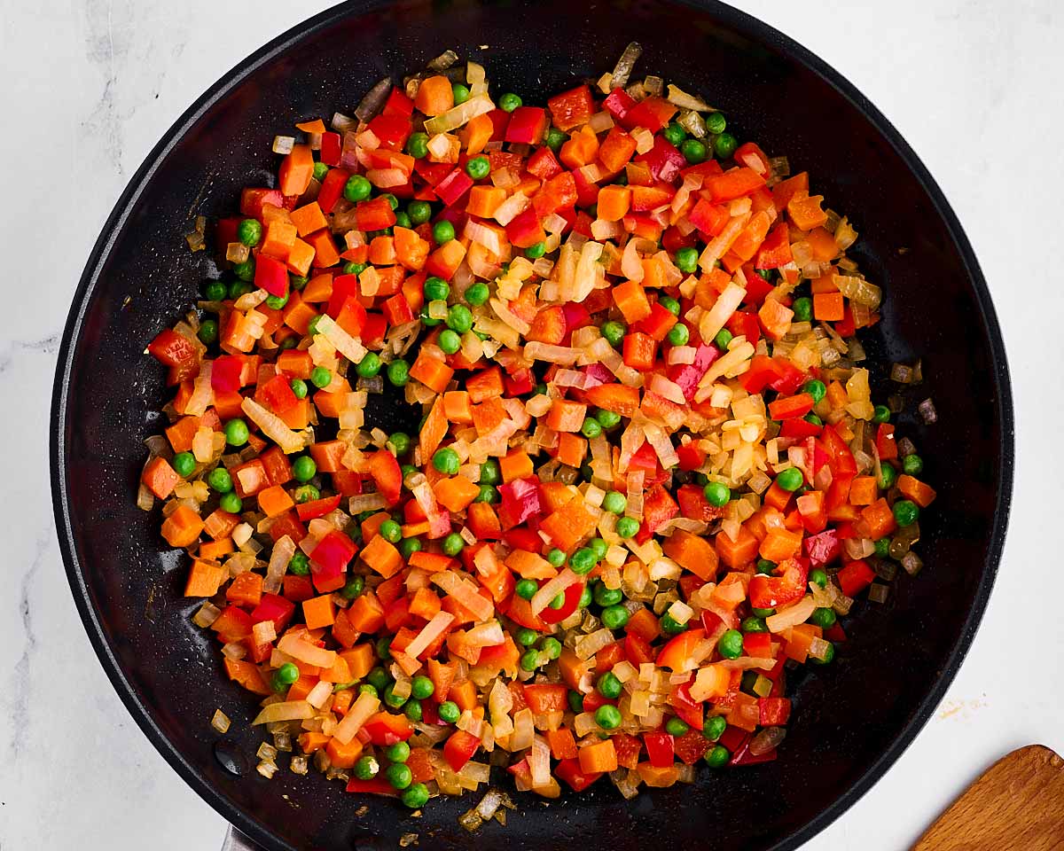 overhead view of cooked vegetables in skillet