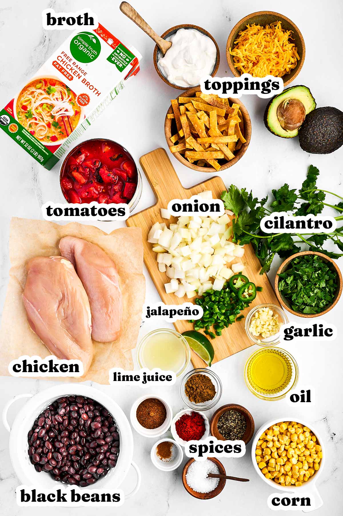 overhead view of chicken tortilla soup ingredients with text labels