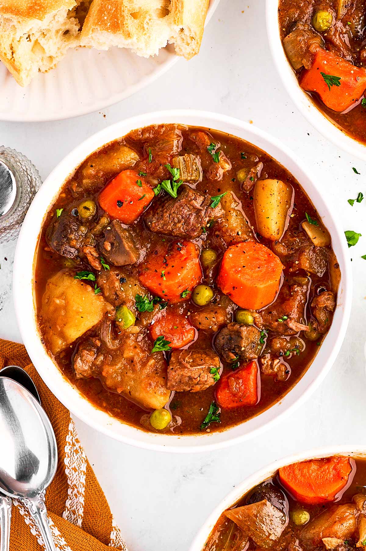 overhead view of beef stew in white bowl