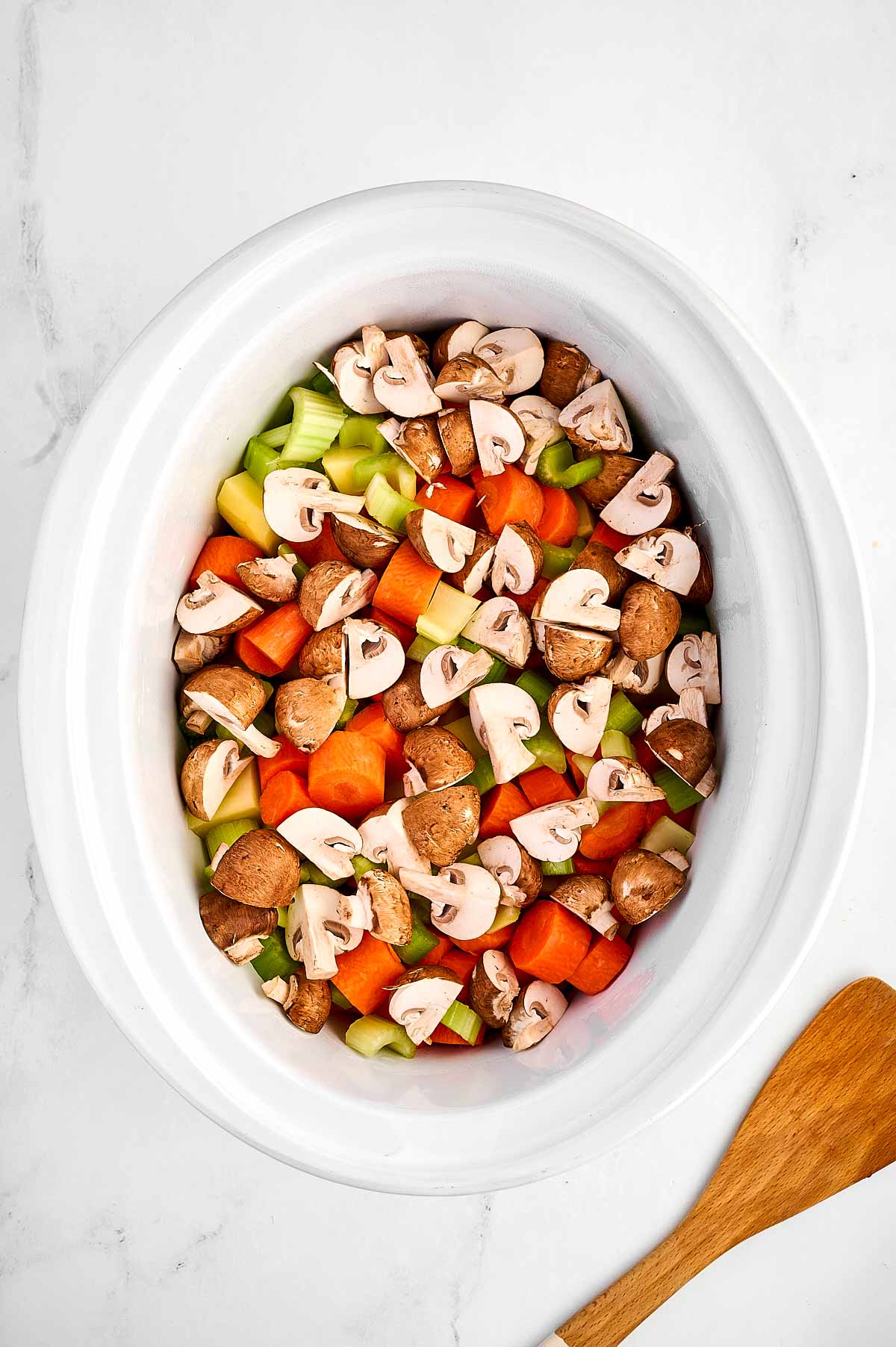 overhead view of vegetables in slow cooker