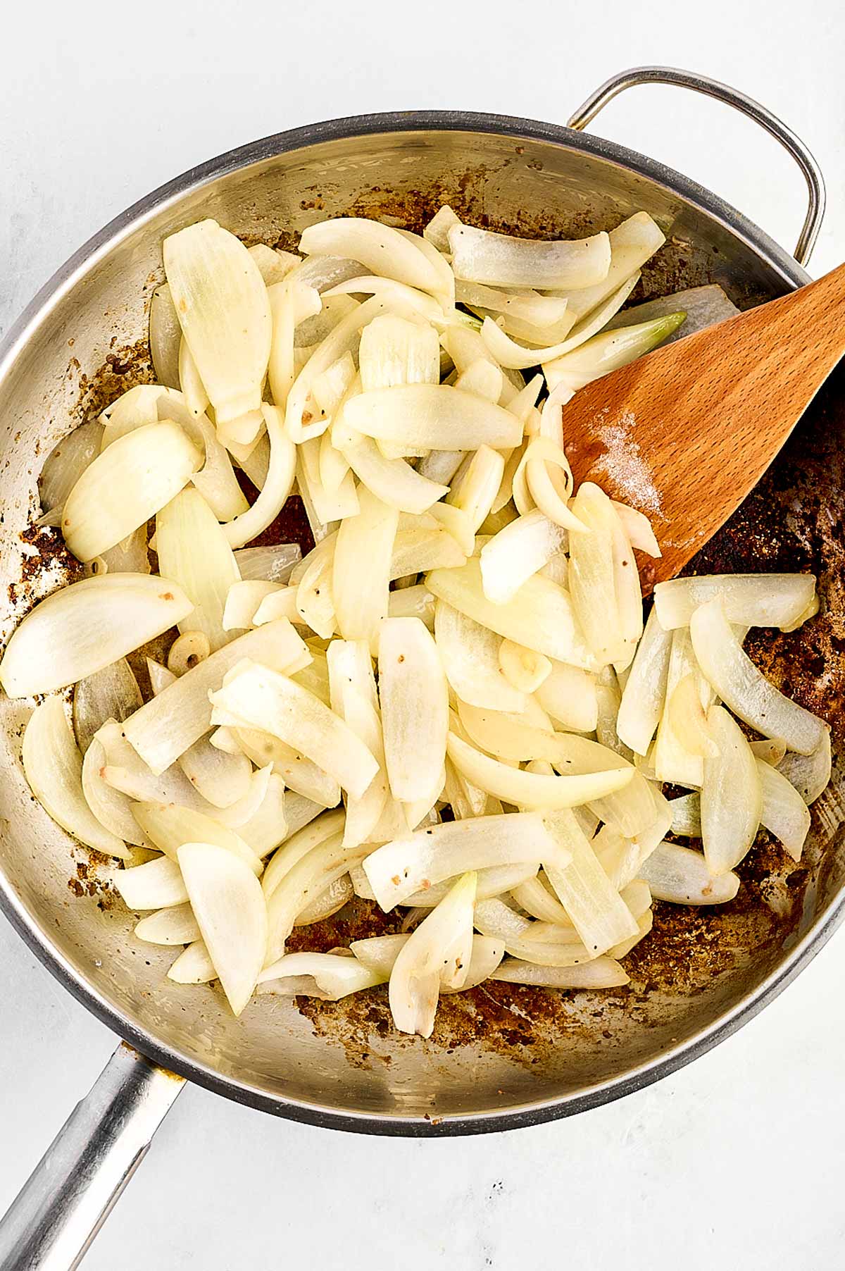 overhead view of cooked onion in skillet