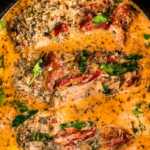 overhead view of tuscan chicken in slow cooker