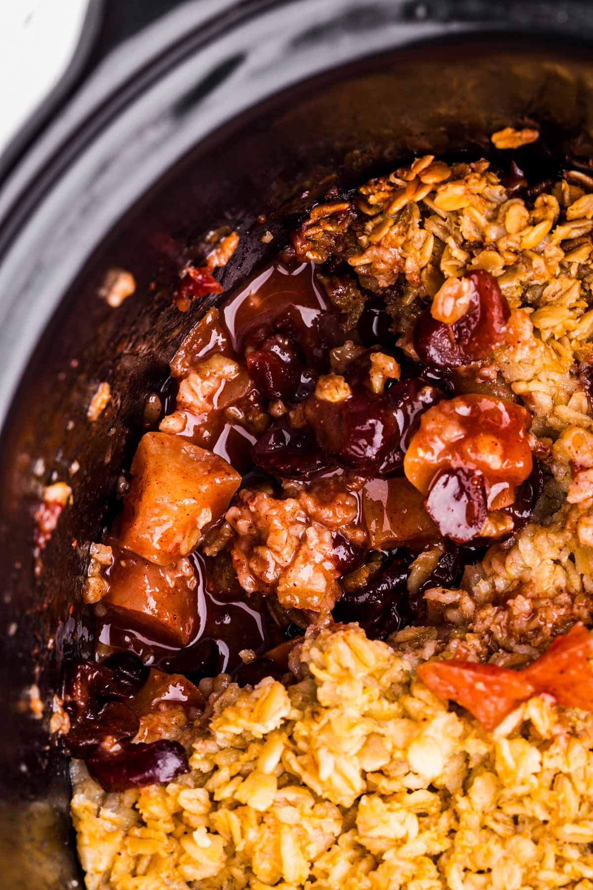 overhead closeup view of apple cinnamon oatmeal in crock