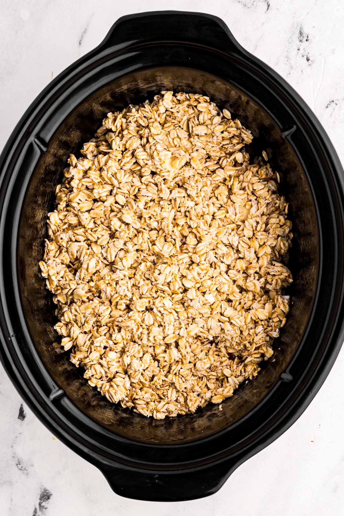 overhead view of oats in slow cooker