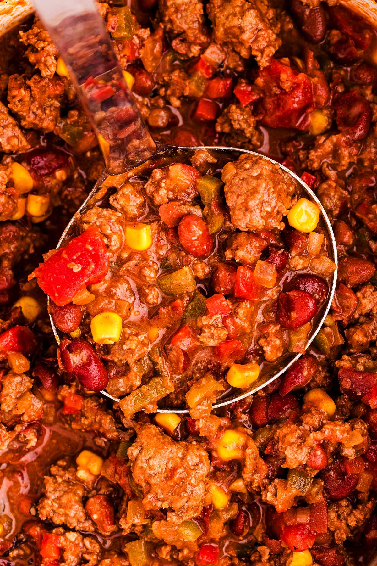 close up view of ladle in chili