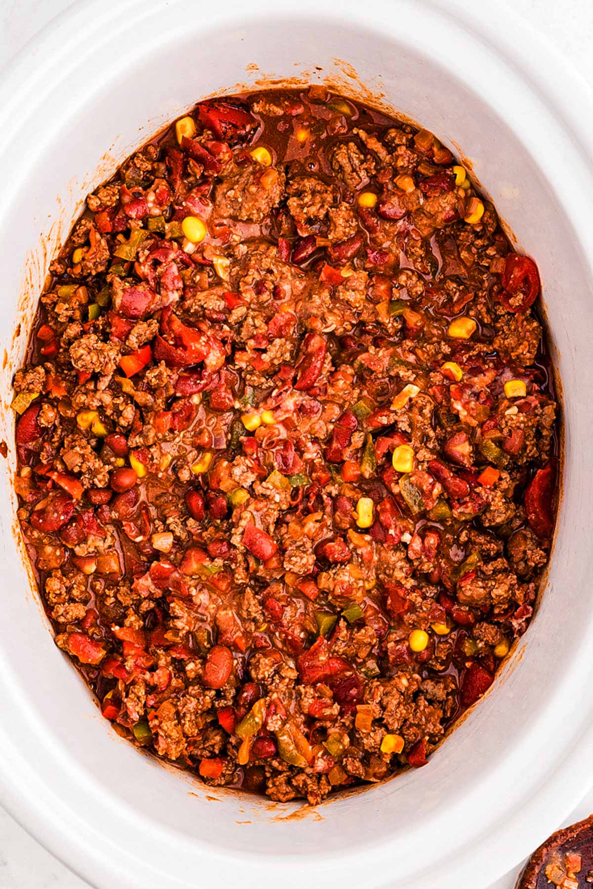 overhead view of ground beef chili in slow cooker