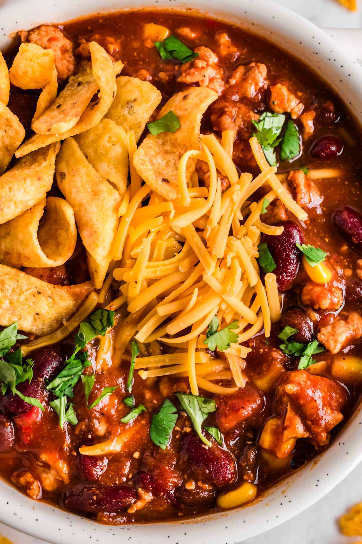 overhead close up view of garnished bowl of turkey chili