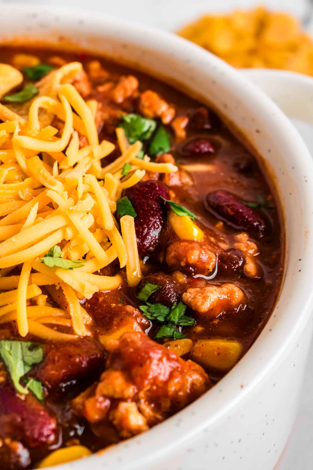 frontal close up of turkey chili with cheese