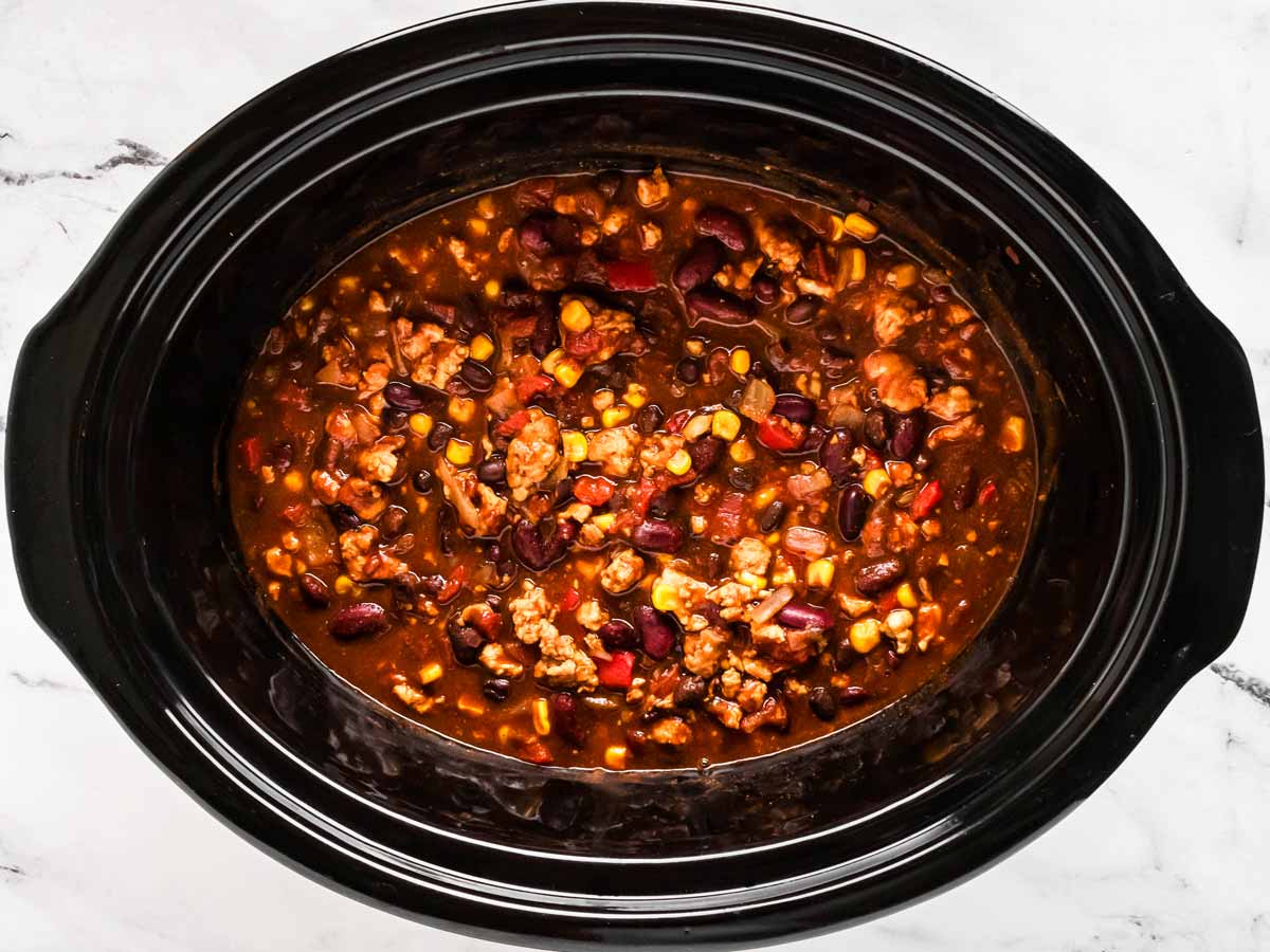 overhead view of cooked turkey chili in slow cooker