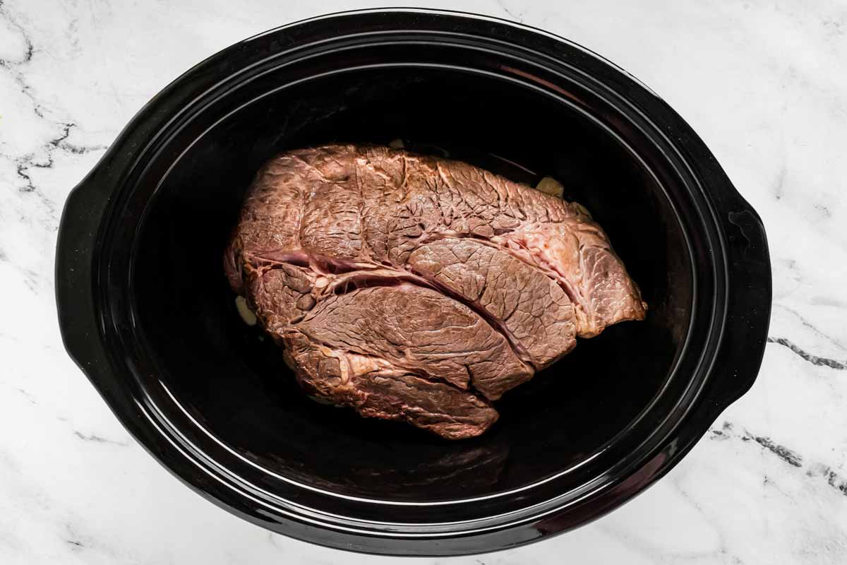 overhead view of roast in slow cooker