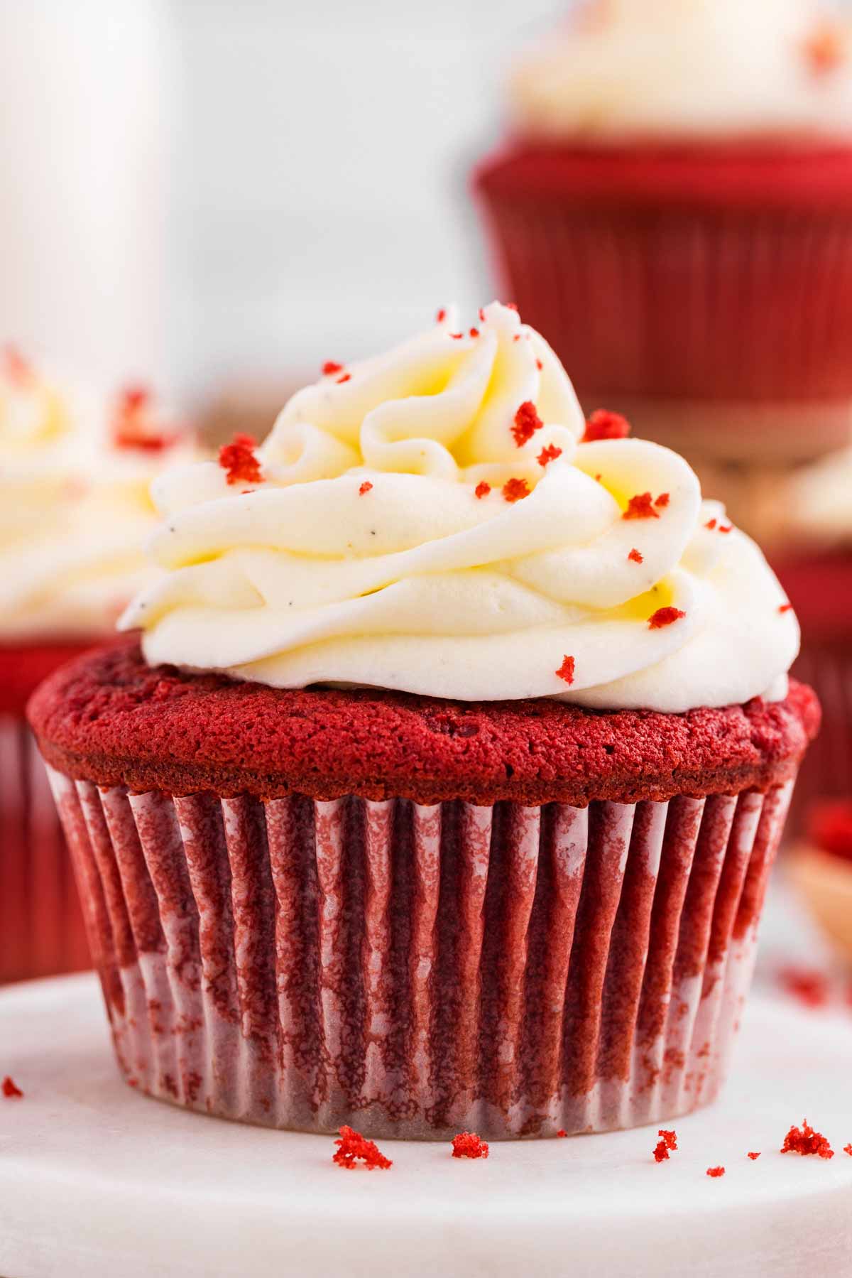 frontal view of red velvet cupcake with cream cheese frosting