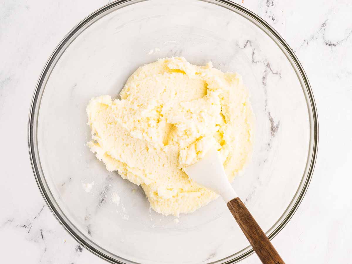 overhead view of creamed ingredients for cupcakes in a bowl