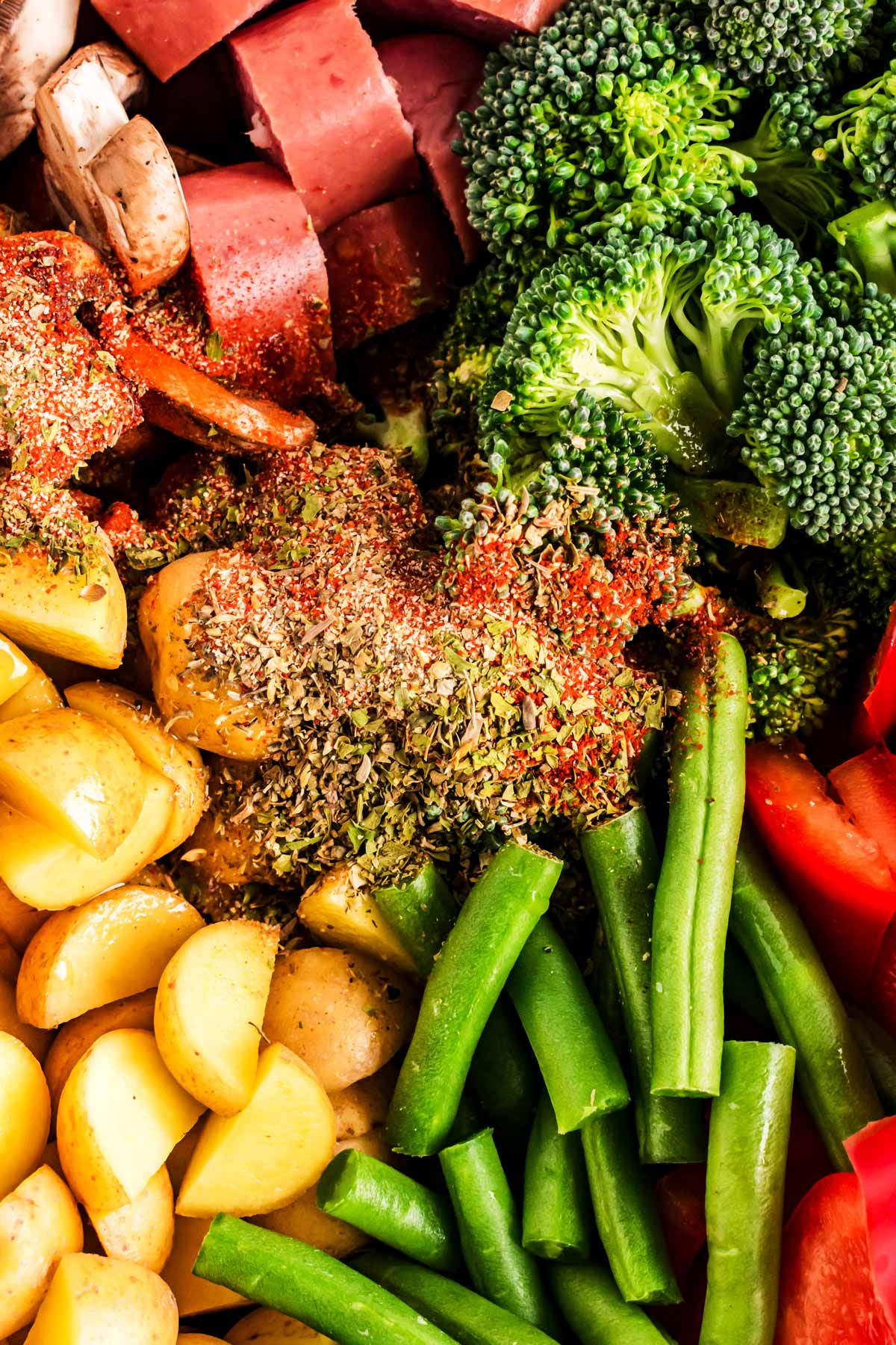 overhead close up of seasoning on top of cut up vegetables