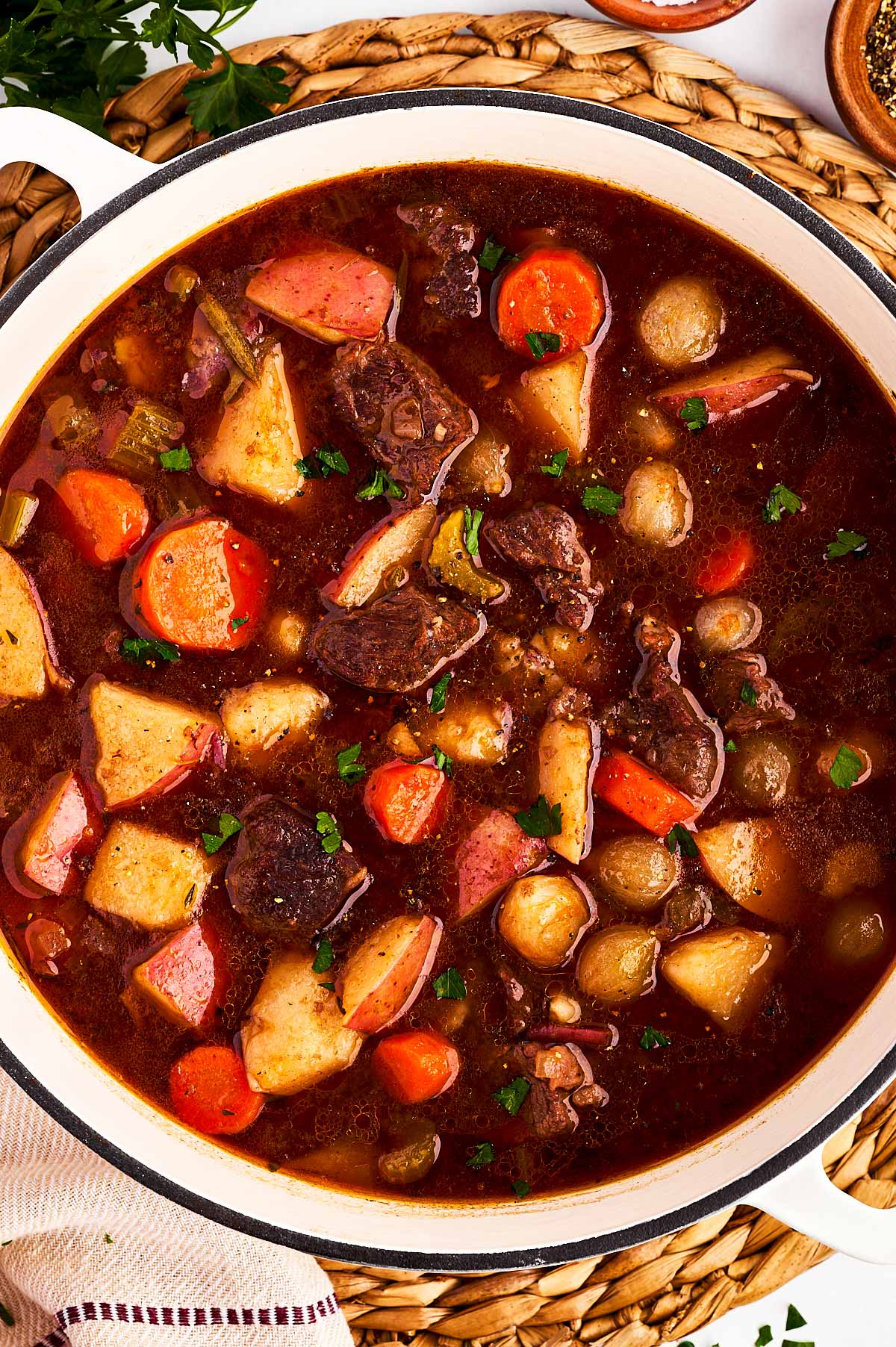 overhead closer up view of beef stew in Dutch oven