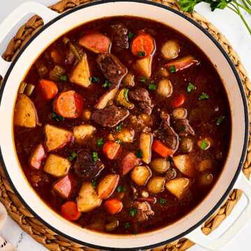 overhead view of beef stew in Dutch oven