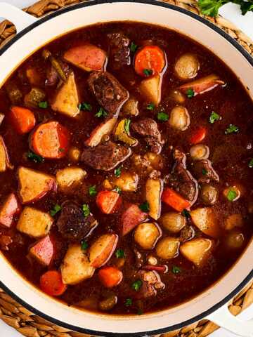 overhead view of beef stew in Dutch oven