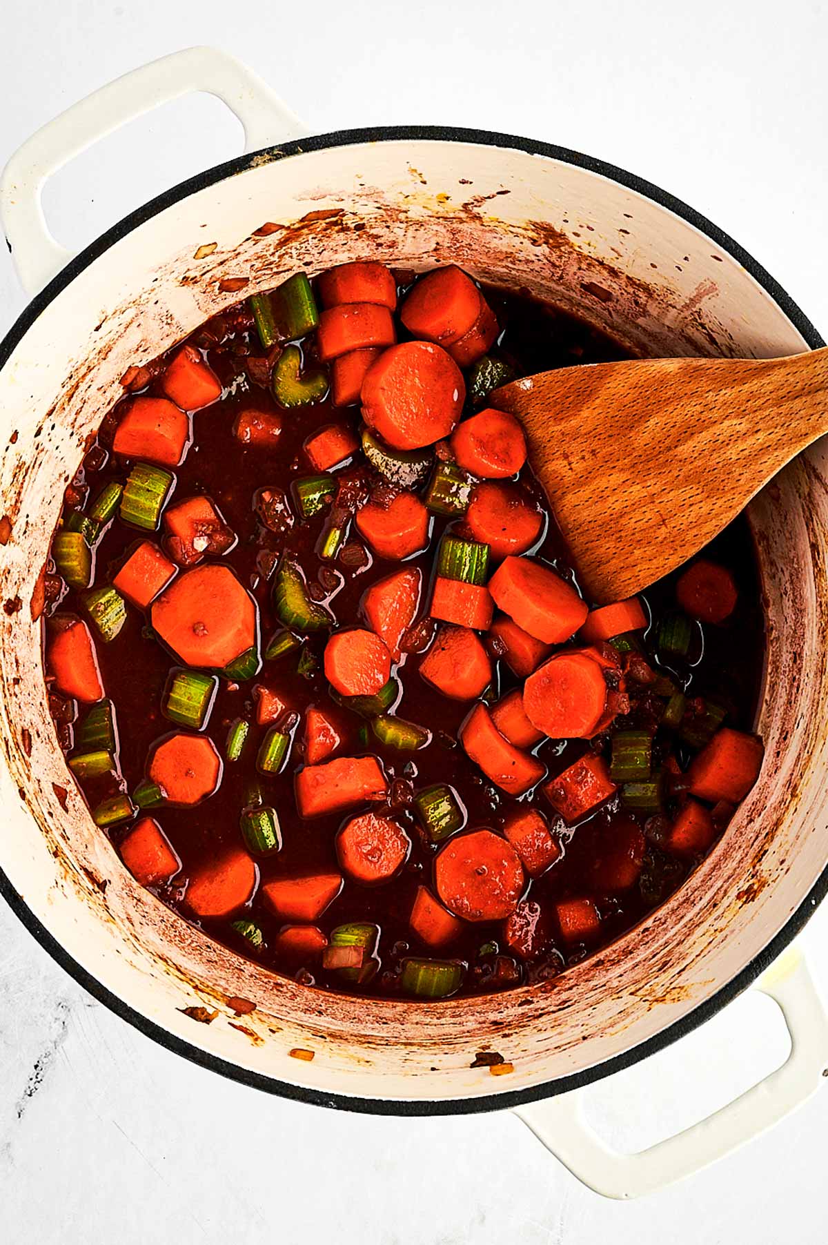 overhead view of beef stew base in Dutch oven