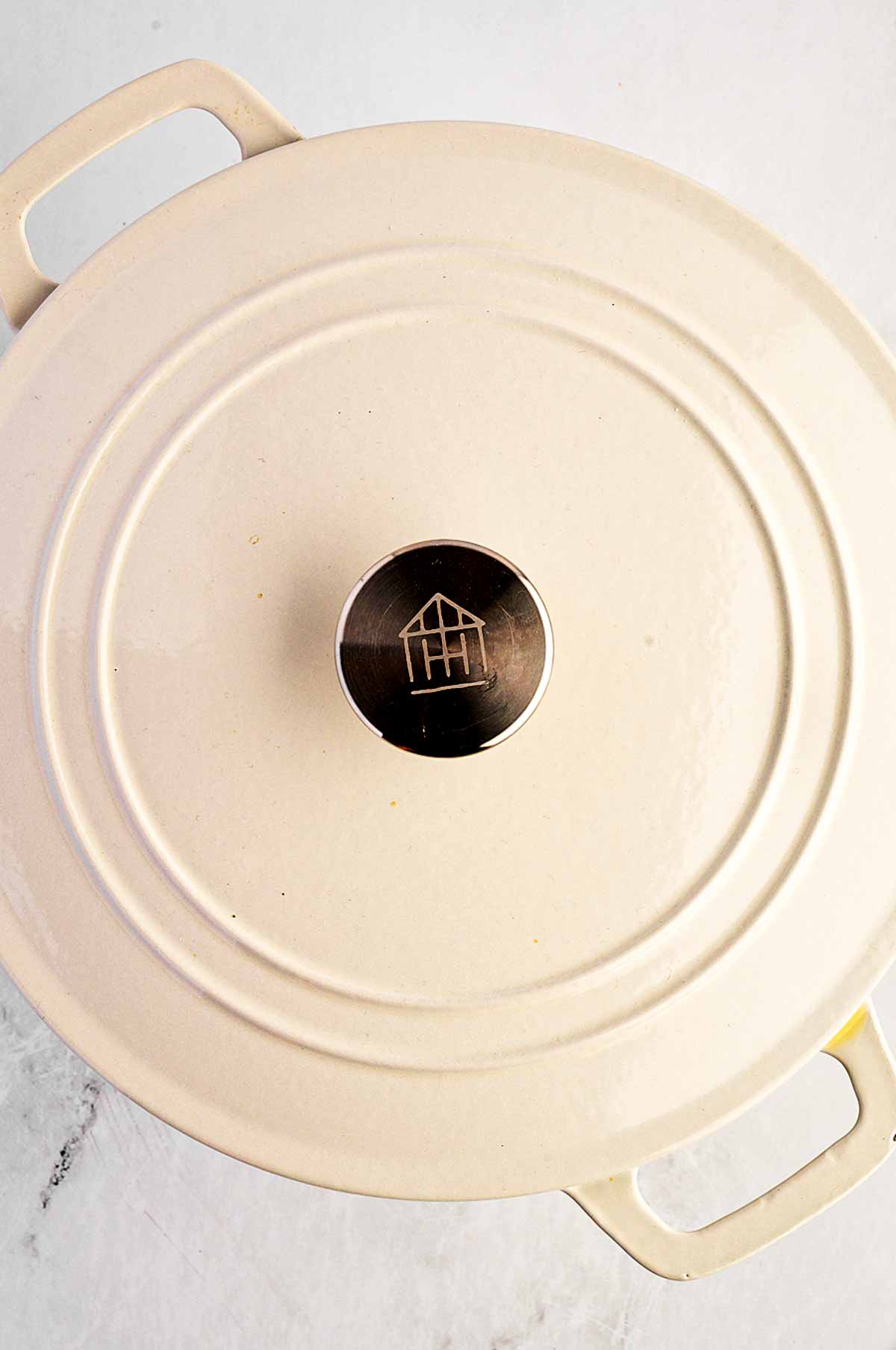 overhead view of white Dutch oven with lid on