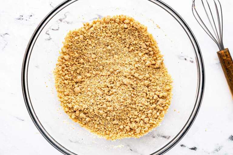 overhead view of breadcrumbs and milk in glass bowl