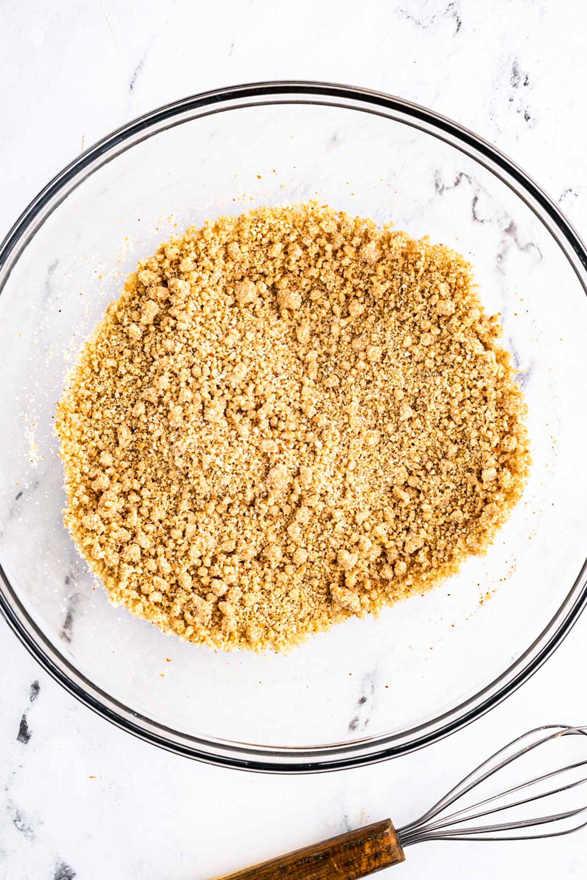 overhead view of breadcrumbs and milk in glass bowl