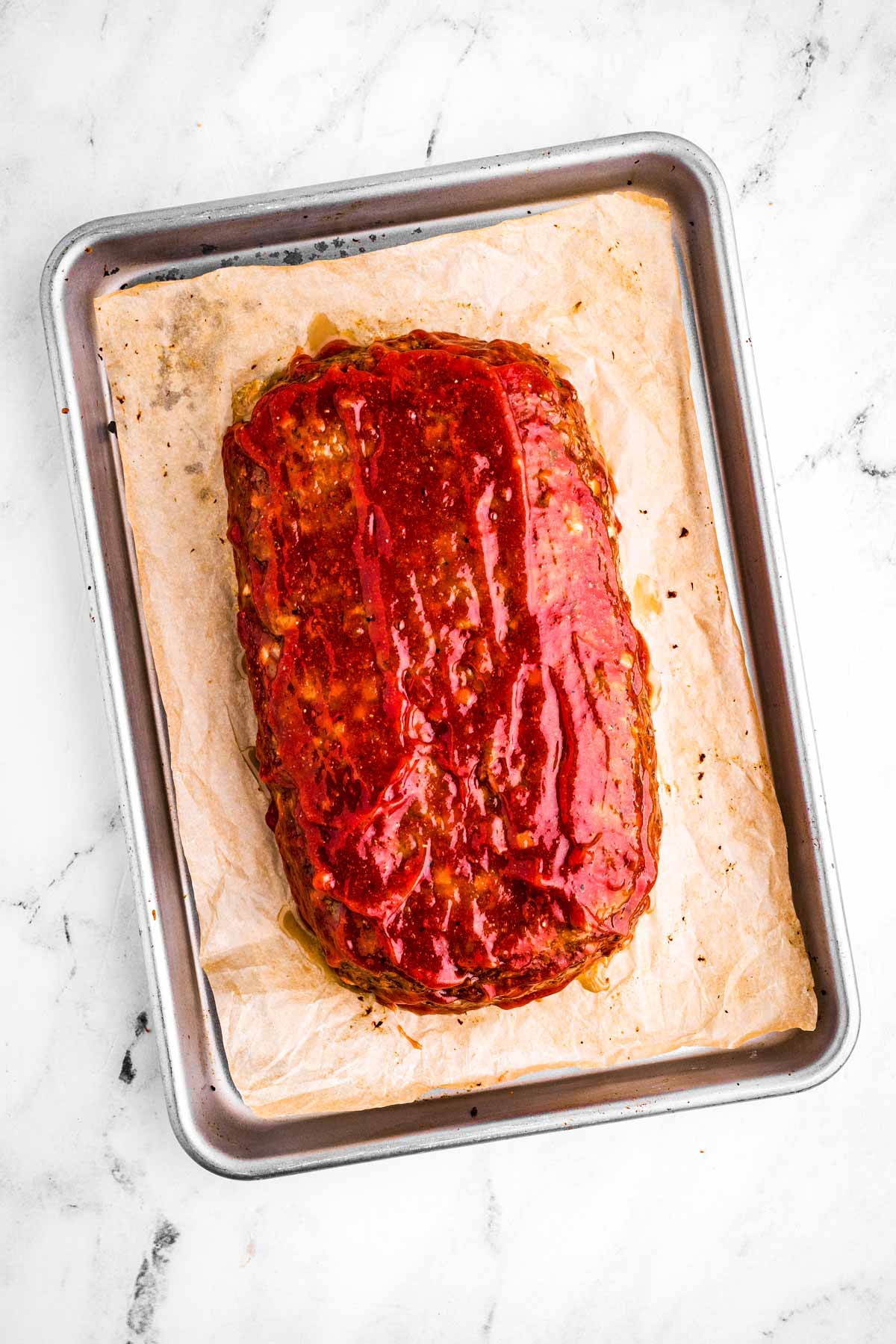 overhead view of glazed partially baked meatloaf