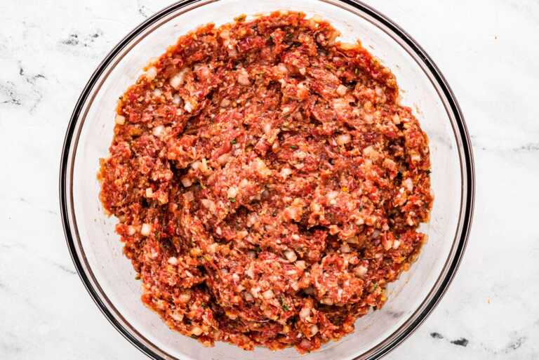 overhead view of meatloaf mixture in glass bowl