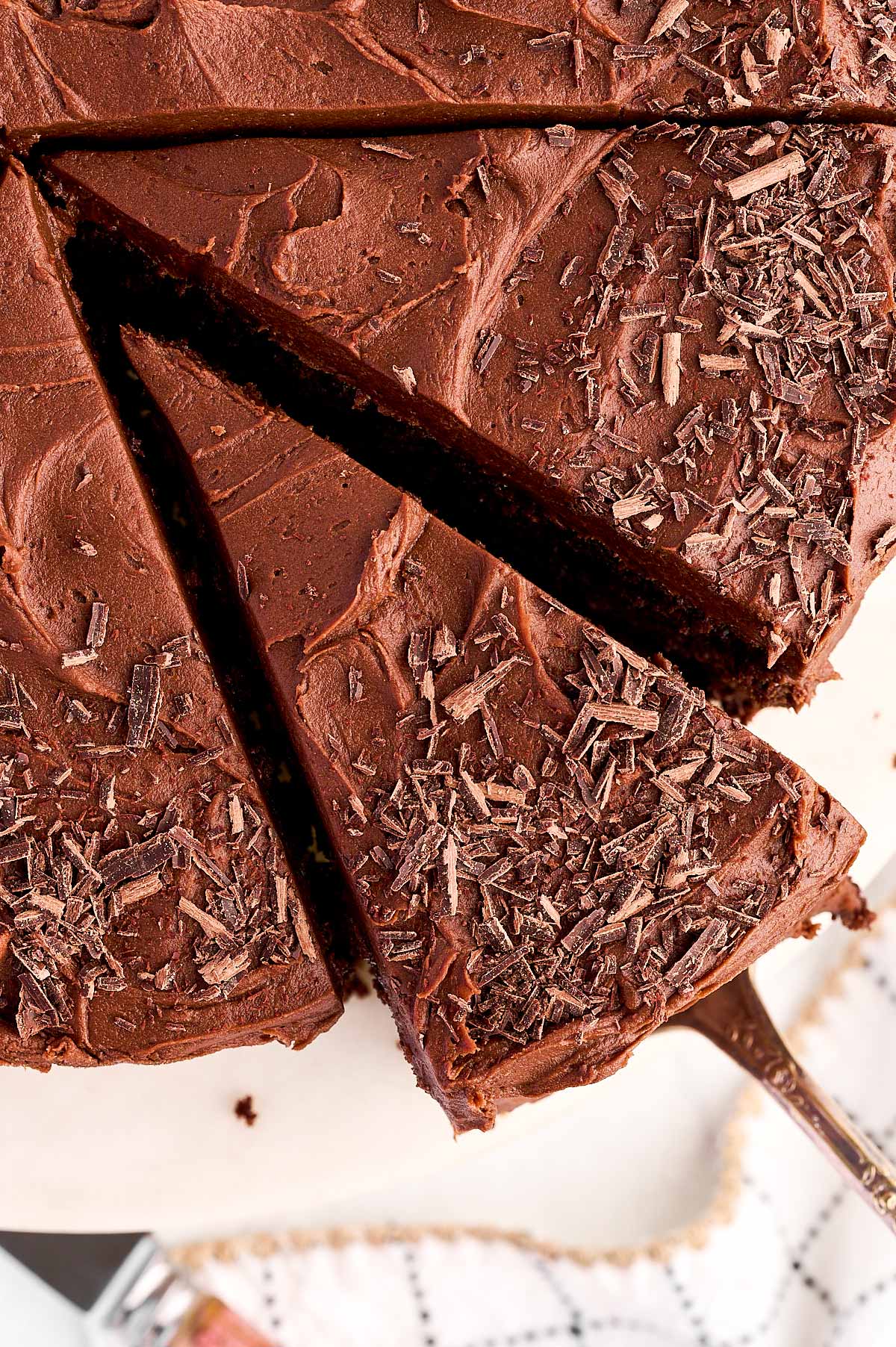 overhead view of sliced chocolate cake