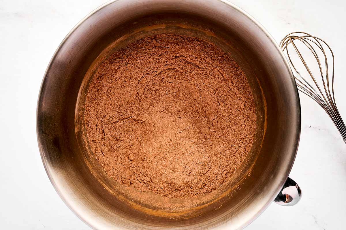 overhead view of dry ingredients for chocolate cake in a bowl