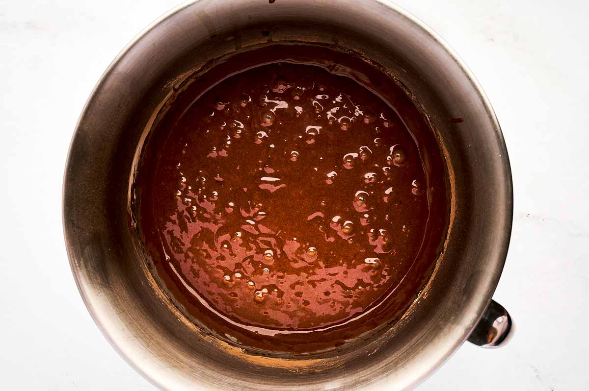 overhead view of chocolate cake batter in bowl