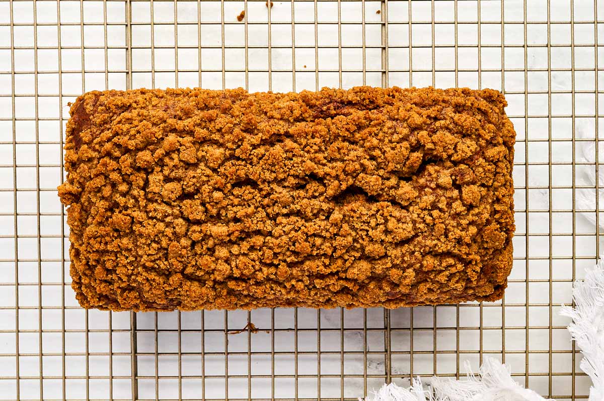 overhead view of baked cinnamon banana bread on wire rack