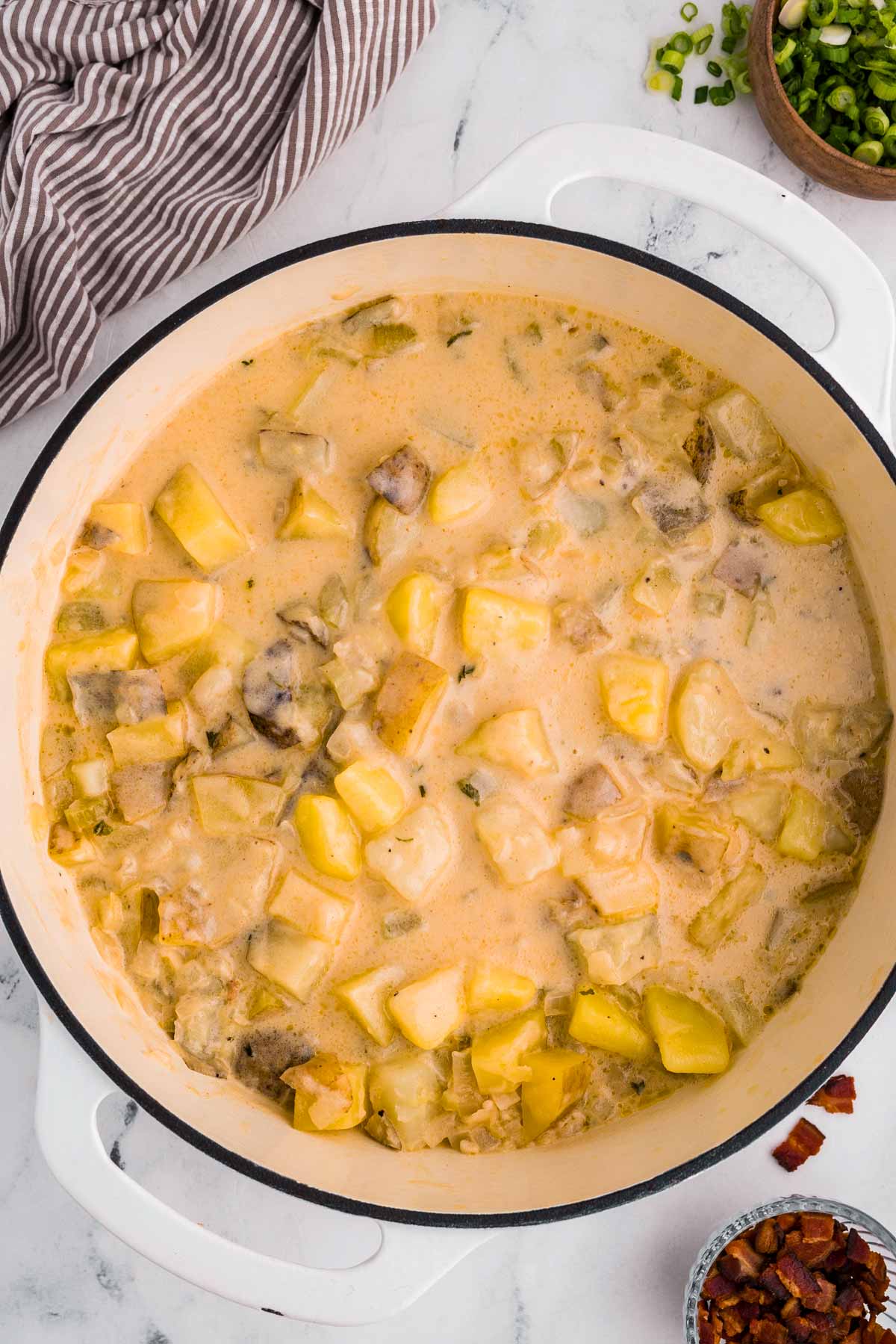 overhead view of potato soup in Dutch oven pot