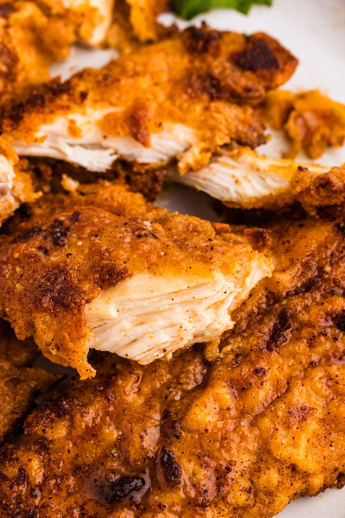 overhead close up view of fried chicken pieces