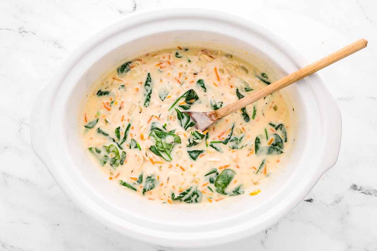 overhead view of chicken gnocchi soup in slow cooker